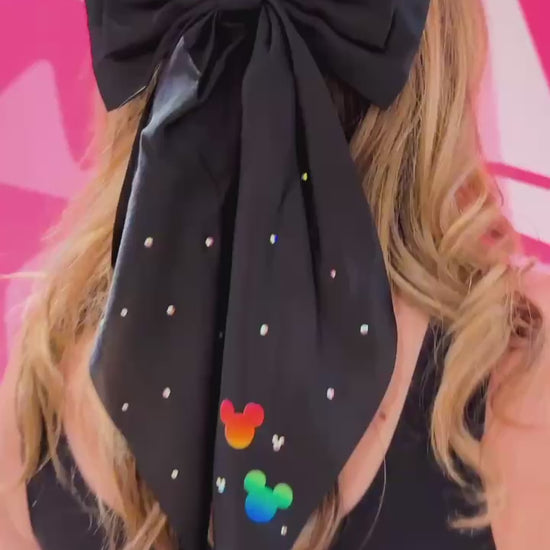 video of black bow with mickey decal and rhinestones